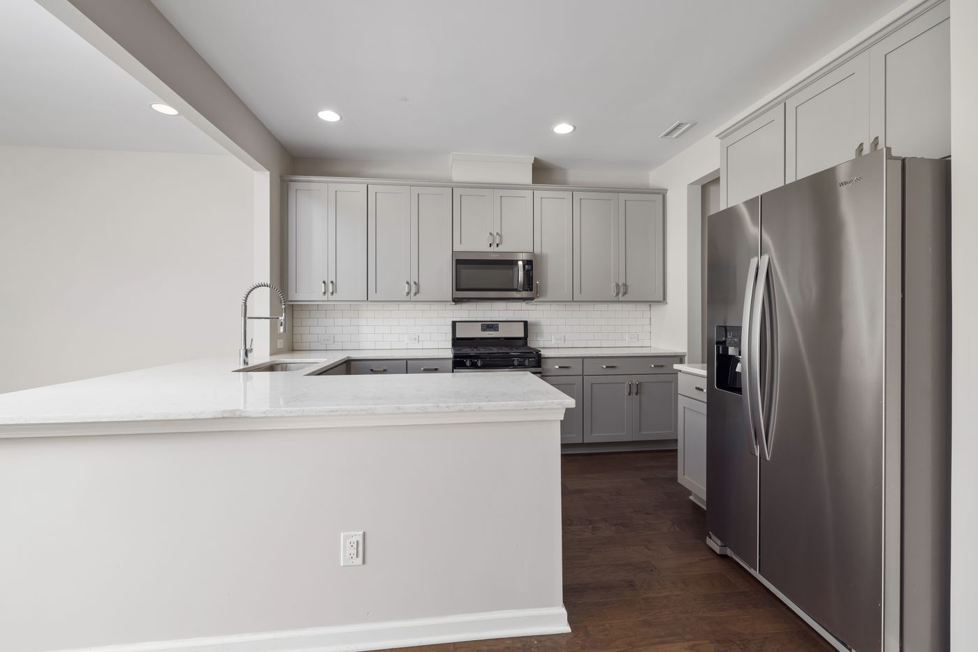 White kitchen with a counter and sink