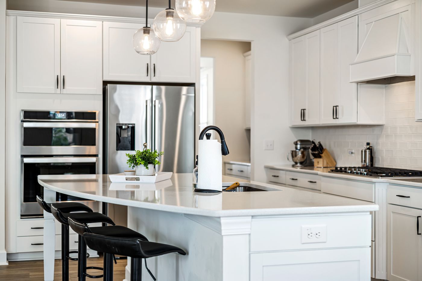 Photograph of kitchen island with pendant lighting